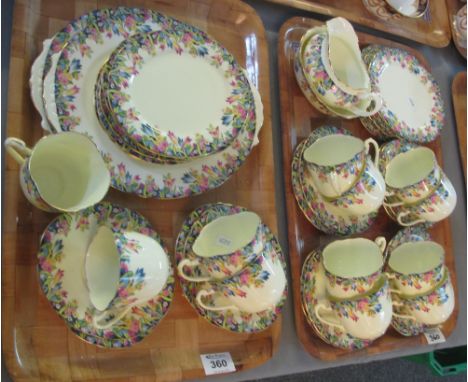 Two trays of Paragon bone china teaware on a lemon ground with multi-coloured flowers and foliage to include; cups, saucers, 