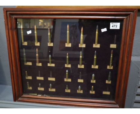 Framed display panel of cartridges and bullets (some loose and all inert).(B.P. 24% incl. VAT)