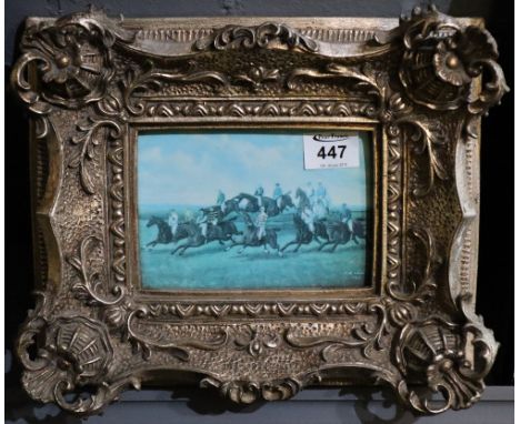 Reproduction porcelain panel printed with horse racing scene in ornate gilt frame.(B.P. 24% incl. VAT)  