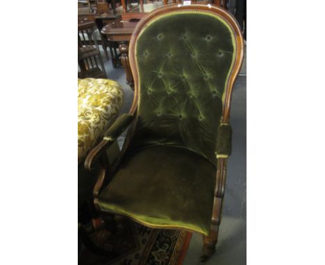 Late Victorian mahogany button back show frame fireside open armchair on turned legs and casters. (B.P. 24% incl. VAT)