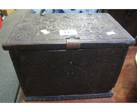 Small 18th Century oak casket with chip carved roundel decoration, wire hinges and skirted base. 29cm wide approx. (B.P. 24% 