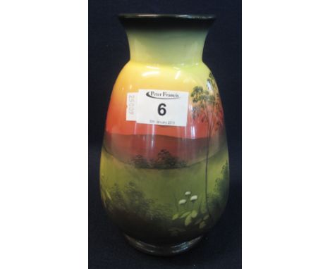 S Fielding & Company Staffordshire pottery 'Soleilian' pottery baluster shaped vase, painted with a continuous country scene 