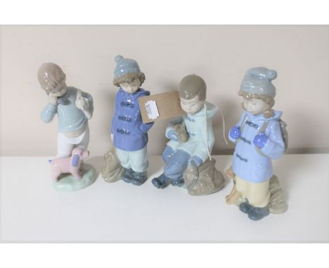 Four Nao figures of boys 