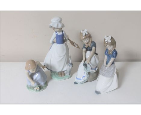 Four Nao figures of girls 