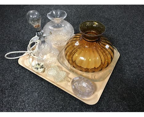 A tray of assorted glass ware to include amber glass oil lamp shade, cut glass table lamp with shade (a/f) and four further g