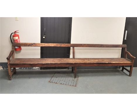 An antique pine bench, length 335cm