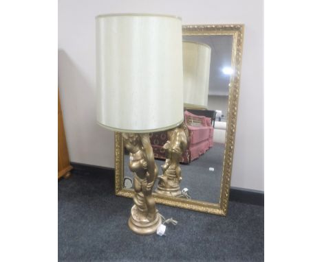 A gilt framed bevelled mirror together with a gilt chalk table lamp and shade 