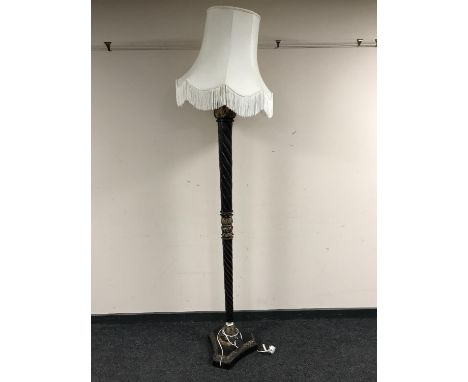 A hardwood and gilt standard lamp with shade 