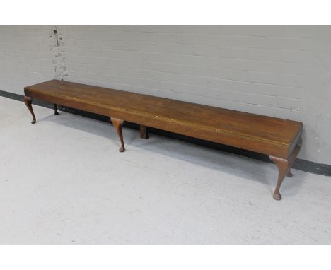 A large mahogany bench on Queen Anne style legs 