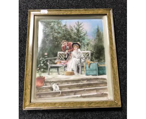 A late 19th century gilt framed hand painted porcelain panel by Margaret J. Knowles depicting two figures at a bench  