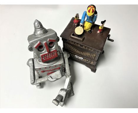Two cast iron novelty money boxes; Organ grinder and a robot