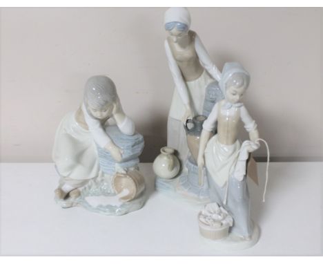 Three Nao figures; lady filling urn at well, girl with spilt milk and wash lady