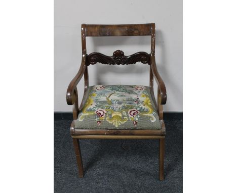 An antique continental mahogany scroll armchair with tapestry seat 