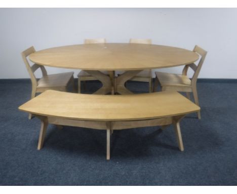 A contemporary oval dining table, shaped bench and four similar dining chairs 