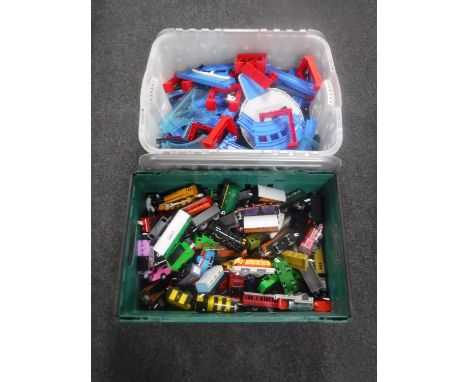 Two boxes containing a large quantity of Tomi Thomas the Tank Engine track and engines