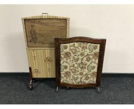 An early twentieth century oak tapestry fire screen together with an Arts and Crafts screen