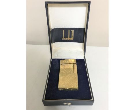 A Dunhill gold plated lighter, boxed