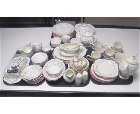 An extensive English floral pottery tea and dinner service with matching cutlery 