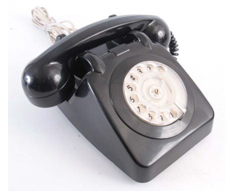 A VINTAGE BLACK PLASTIC TELEPHONE 