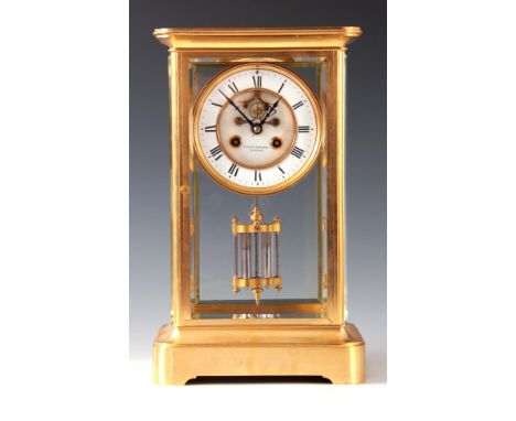 A LATE 19th CENTURY FRENCH GILT BRASS FOUR-GLASS MANTEL CLOCK the rectangular moulded case with four inset bevelled glass pan