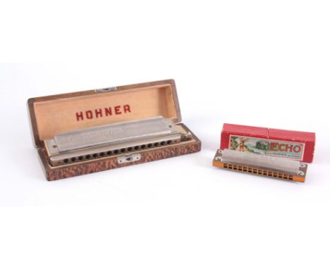 A HOHNER 64 CHRONOMICA HARMONICA in original box, with a HOHNER ECHO HARMONICA in original box