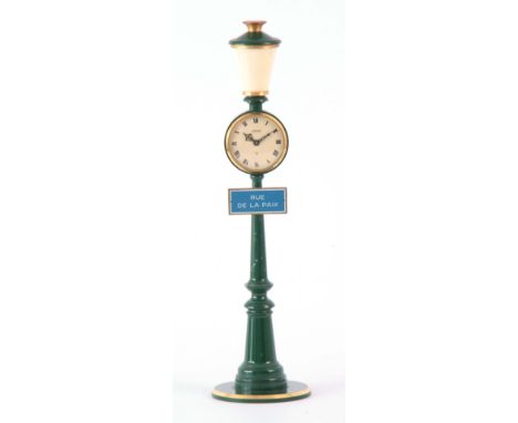A 1960's JAEGER NOVELTY MANTEL CLOCK modeled as a street lamp with a blue street sign for 'RUE DE LA PAIX' below e Roman crea