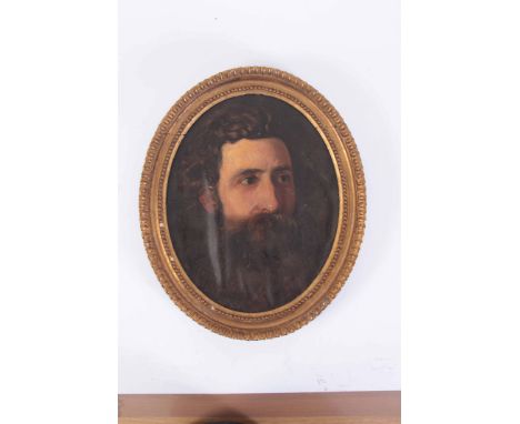 AN EARLY 19TH CENTURY OIL ON CANVAS LAID ON BOARD PORTRAIT OF A BEARDED GENTLEMAN in a moulded oval gilded frame 35cm high 28