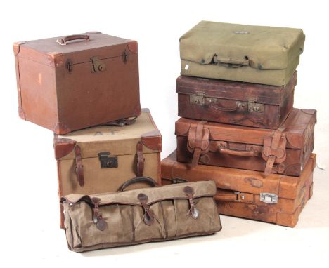 A SELECTION OF VINTAGE LEATHER AND CANVAS LUGGAGE 