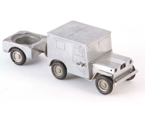 A VINTAGE GERMAN MADE SMOKERS COMPENDIUM by W BAIER modeled as a jeep and trailer with lighter, cigarette case and ashtray 24