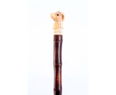 A LATE 19th CENTURY IVORY RAMS HEAD SWORDSTICK having amber glass eyes on a bamboo cane enclosing a square sectioned steel bl