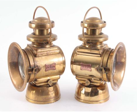 A LARGE PAIR OF BRASS LUCAS 664 'KING OF THE ROAD' OIL SIDE LAMPS with two-tier chimney and loop handles 36cm high