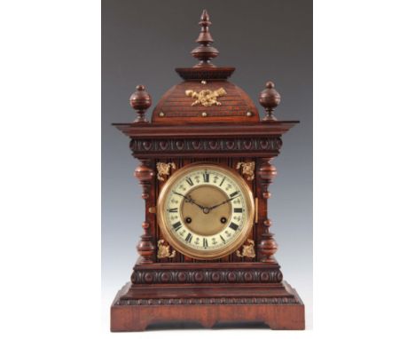 A LATE 19th CENTURY GERMAN WALNUT CASED MANTEL CLOCK having an architectural style case with gilt brass mounts enclosing a 5"