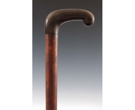 A 19TH CENTURY MALACA WALKING STICK with a horn handle 92cm high.