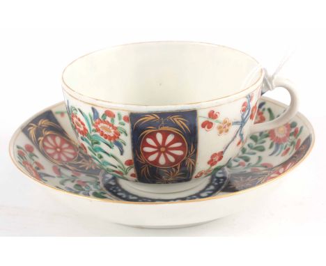 A First Period Polychrome Worcester TEA CUP and SAUCER with colourful flower spray decoration in the "Queens" pattern blue sq