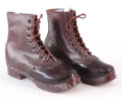 A PAIR OF VINTAGE LEATHER WOODEN SOLED BOOTS 17cm high