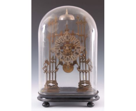 A LATE 19th CENTURY ENGLISH SKELETON CLOCK the 7" pierced engraved silvered chapter ring fronting a gothic pierced framed eig