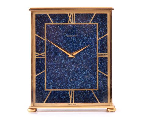 A SWISS JAEGER-LECOULTRE MANTEL CLOCK having a gilt brass case enclosing a blue lapis style dial with pierced gilt chapter ri