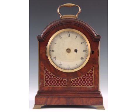 A SMALL REGENCY FIGURED MAHOGANY BRACKET CLOCK the break arch case with brass fish scale frets and brass locking bezel enclos