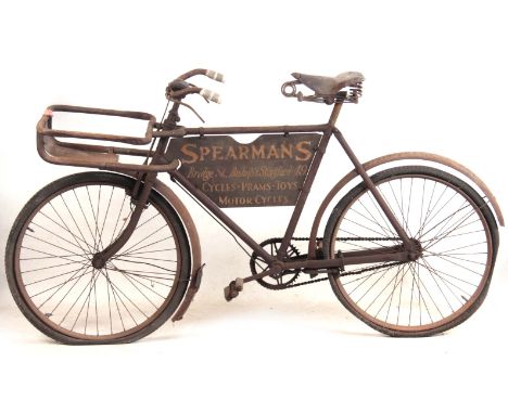 A VINTAGE DELIVERY BICYCLE advertising Spearman's, Bridge Street, Bishops Stortford: 49. Cycles - Prams - Toys - Motor Cycles