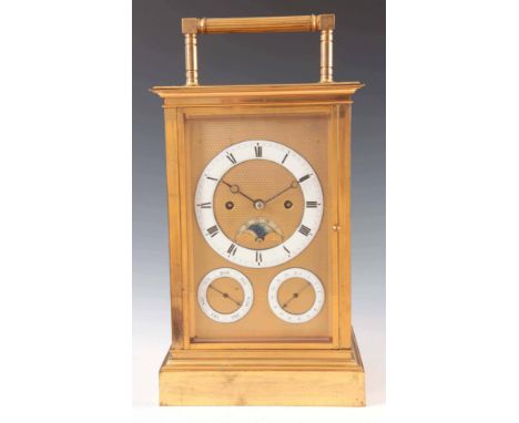 AN EARLY 20TH CENTURY GIANT DOUBLE FUSEE CARRIAGE CLOCK the brass case with four bevelled glass panels and reeded carrying ha