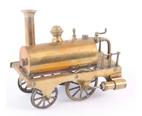 A BRASS MODEL OF A STEAM ENGINE having been made from a telescope part and signed by Newton &amp; Co. 15cm wide 13.5cm high. 