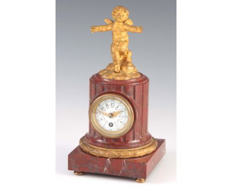 A FRENCH ROUGE MARBLE AND ORMOLU MANTEL CLOCK with later movement 22.5cm high
