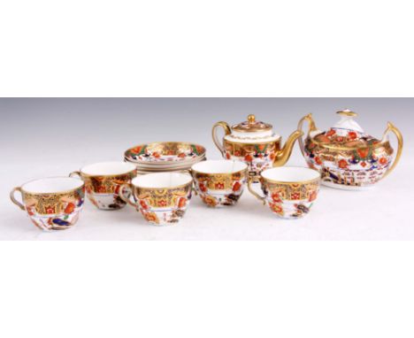 AN EARLY 19TH CENTURY SPODE TYPE PORCELAIN PART TEA SERVICE comprising teapot, oval two handled lidded sucrier, five cups and