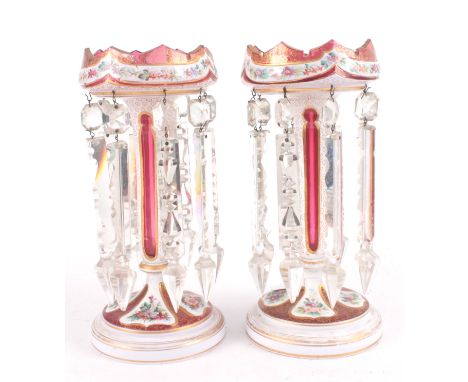 A PAIR OF 19TH CENTURY BOHEMIAN STYLE RUBY AND OPAQUE GLASS LUSTRES with gilt and painted floral decoration; having cut glass
