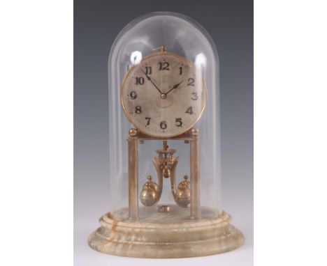 A 1930's 400 DAY MANTEL CLOCK having a 4" silvered Arabic dial fronting a spring driven movement with rotating pendulum mount