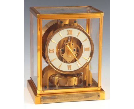 LECOULTRE. A 1950'Ss SWISS ATMOS CLOCK the gilt brass case with canted corners inset with five glass panels enclosing a 5" wh