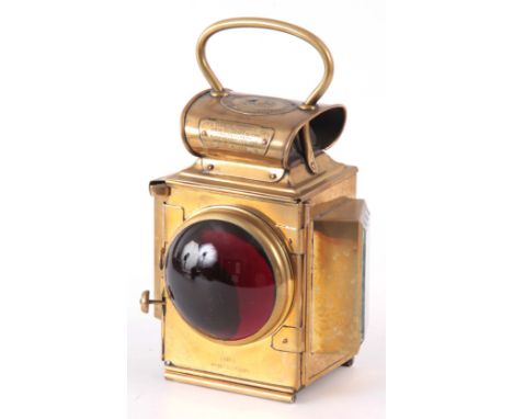 A BRASS MERRYWEATHER &amp; SON FIRE ENGINE REAR LAMP with large red convex glass lens 28cm high 