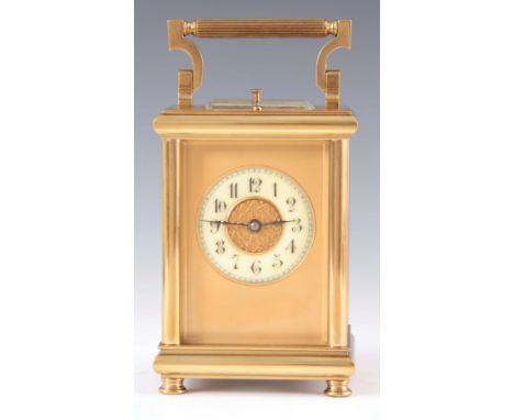 A LATE 19th CENTURY FRENCH REPEATING CARRIAGE CLOCK the moulded brass case with reeded hinged handle enclosing a 6.5cm gilt m