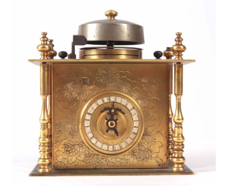 A MID 19th CENTURY JAPANESE TABLE CLOCK the gilt brass floral engraved case with four turned pillars enclosing a 2" rotating 