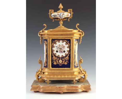 A LATE 19TH CENTURY FRENCH ORMOLU AND PORCELAIN PANEL MANTEL CLOCK the gilt brass case with chased leaf-work decoration surmo